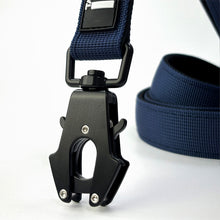 Load image into Gallery viewer, A close-up of a black metal quick-release clip attached to a navy blue woven strap, with a coiled section of the same strap visible in the background on a white surface.
