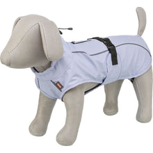 Load image into Gallery viewer, A light blue dog coat displayed on a beige dog mannequin against a plain white background. The coat features black straps and a small red and white brand label on the front.