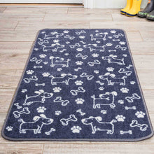 Load image into Gallery viewer, Navy blue mat with white dog and paw prints on a wooden floor.