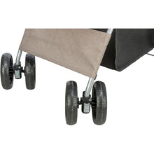 Load image into Gallery viewer, Close-up of a stroller or cart showing the lower frame, three black wheels, a beige fabric panel, and part of a black storage basket on a white background.
