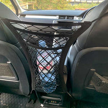 Load image into Gallery viewer, barrier net clips to headrests of vehicle
