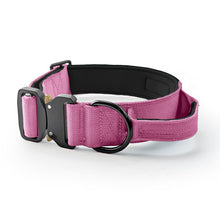Load image into Gallery viewer, A pink adjustable dog collar with a black plastic buckle, black metal ring, and black padded interior, shown on a clean white background.

